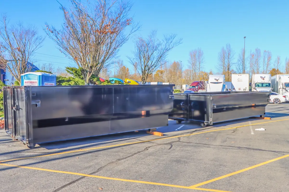 Professional dumpster rental service with roll-off container on residential driveway in Yreka